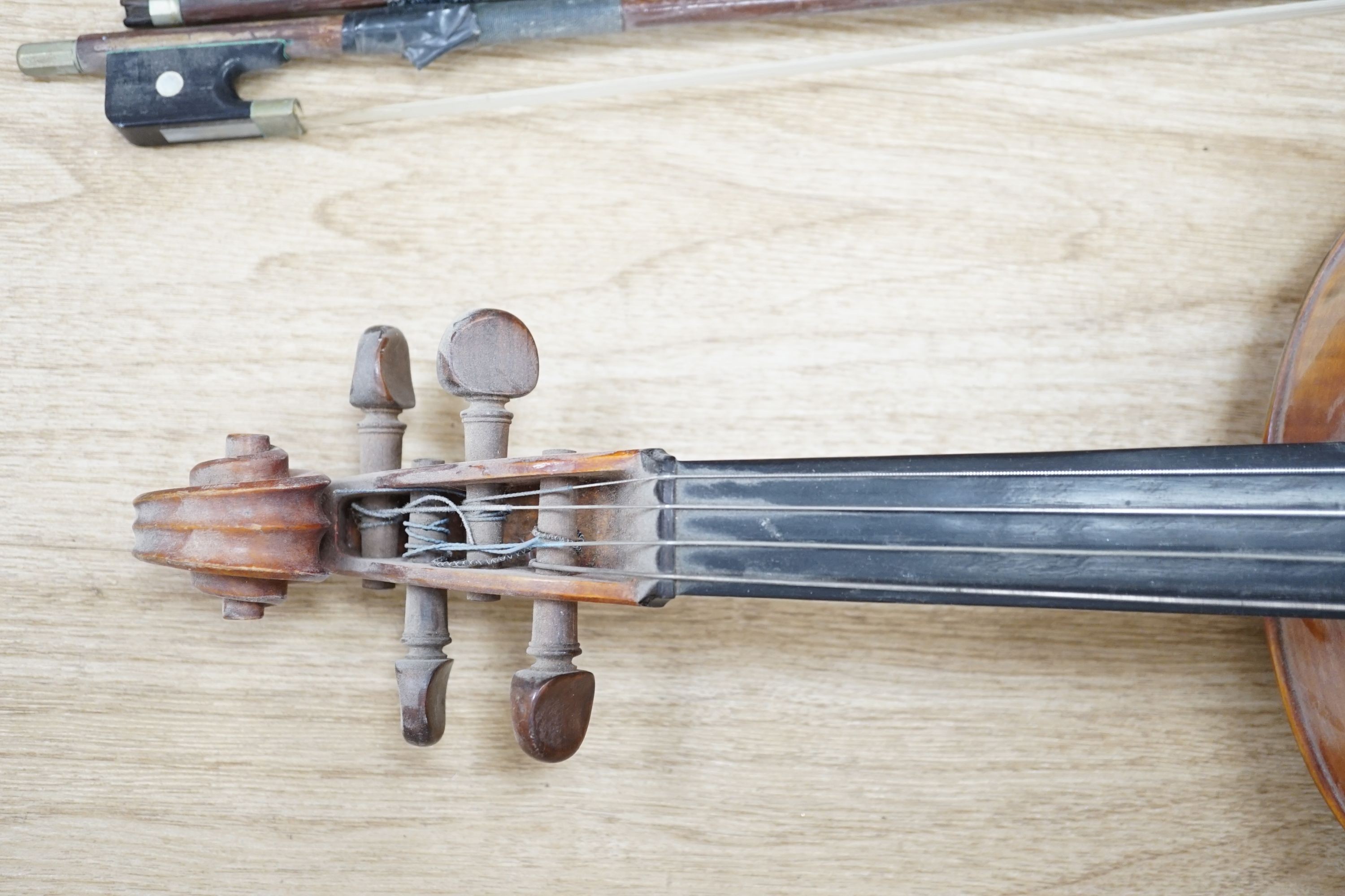 A Viola, assorted bows and a violin back